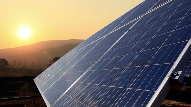 Solar panels with sunrise time lapse