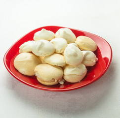red plate with meringues
