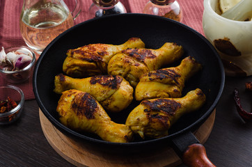 Chicken legs grilled on grill pan