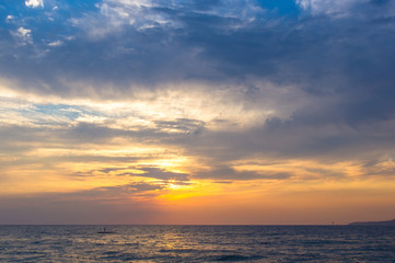 Naklejka na ściany i meble Amazing sea sunset, the sun, waves, clouds