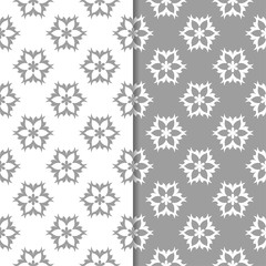 White and gray floral ornaments. Set of seamless backgrounds