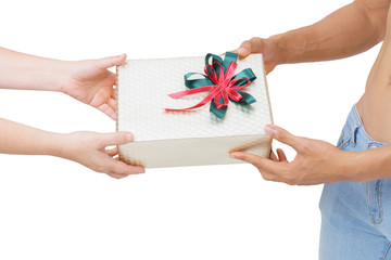 man shirtless in fashionable blue jean handing present / gift to woman's hands isolated on white background