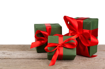 Birthday holiday gift boxes in wrapping paper on white wood