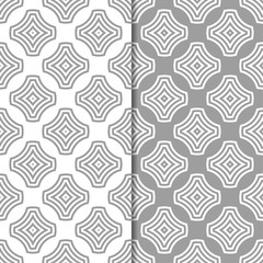 Gray and white geometric ornaments. Set of seamless patterns