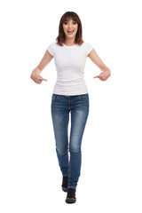 Young Woman Is Walking Towards Camera, Pointing At Her Waist And Talking