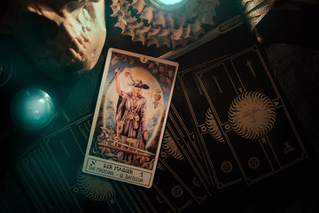 Tarot card / View of tarot card on the table under candlelight. Dark tone. - obrazy, fototapety, plakaty