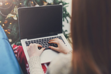 Woman shopping online on laptop