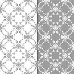 White and gray floral backgrounds. Set of seamless patterns