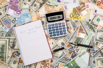 Fototapeta na wymiar newyear goals for 2018 with dollar and euro banknotes