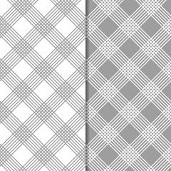 Gray and white geometric ornaments. Set of seamless patterns