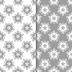 White and gray floral ornaments. Set of seamless backgrounds