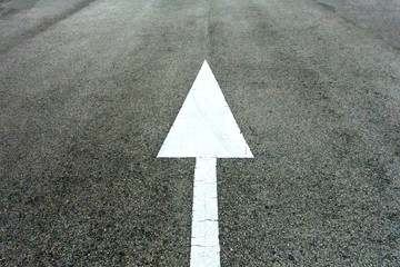asphalt road with white arrow