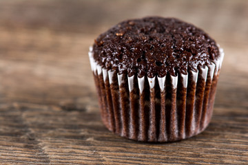 Chocolate muffins on wooden table