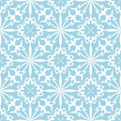 Blue flowers on white background. Ornamental seamless pattern