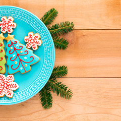 Christmas homemade snowflake  and christmas tree cookies on plate.