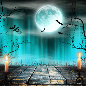Spooky Halloween background with candles.