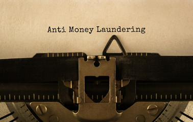 Text Anti Money Laundering typed on retro typewriter