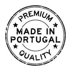Grunge black premium quality made in Portugal round rubber seal stamp on white background