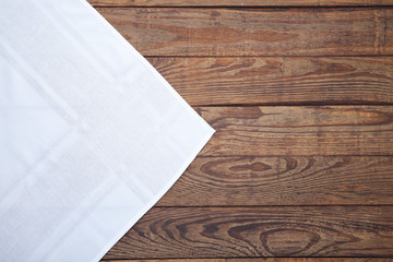 Old vintage wooden table with white tablecloth. Top view mockup.
