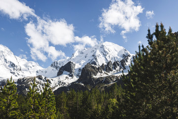 Snow mountain peaks of Caucasus mountains in cold cloudy weather, Elbrus Region. Top of Ullu-Tau mountain