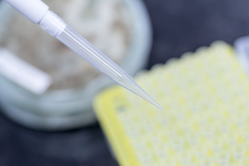 Backgrounds of Science research with 96 wells microplate for laboratory testing.