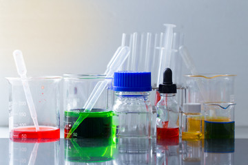 Backgrounds of Science research with glassware for laboratory testing.