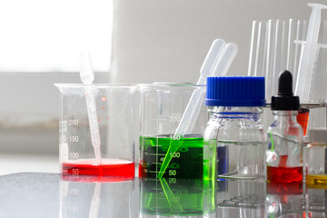Backgrounds of Science research with glassware for laboratory testing.