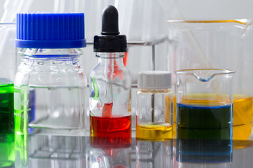 Backgrounds of Science research with glassware for laboratory testing.