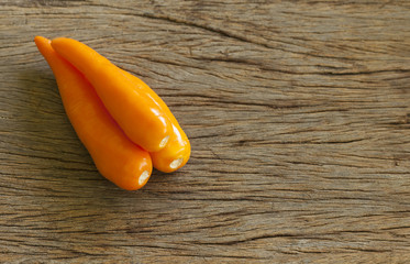 Group chilli yellow on wooden table