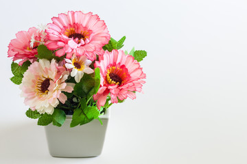 Vase of flowers on a white background.