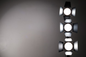 Several reflectors on the black background in photo studio.