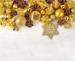 Fototapeta na wymiar Golden Christmas decorations on a white