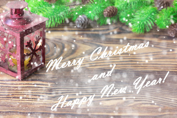 Christmas composition. Christmas and New Year decoration with fir tree branches, lantern on wooden background