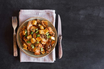 Traditional Asian Tatar dish. Stewed potatoes with mutton and vegetables on the chalkboard