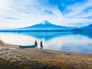 silhouette asia couple traveler 30s to 40s walking at side of lake kawaguchi on morning time with...
