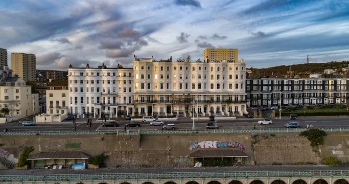 Aerial ascending time lapse view of the town of Brighton at sunset, Southern England (hyperlapse)