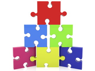 Pyramid of puzzle pieces in various colors
