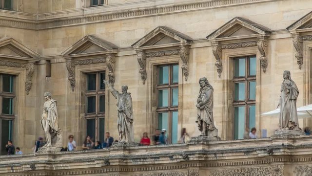 The facade of a building with male statues in the vicinity of the Louvre timelapse, Paris, France.