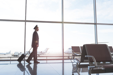 Aviator walking through waiting hall