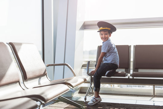 Cheerful smiling little boy in terminal