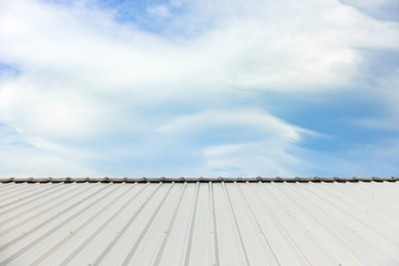 metal corrugated roof sheets against cloudy sky background