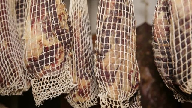 salami made with pork neck,  hanging to mature. Capocollo