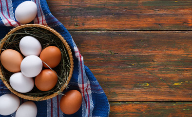 Fresh chicken eggs on rustic wood copy space