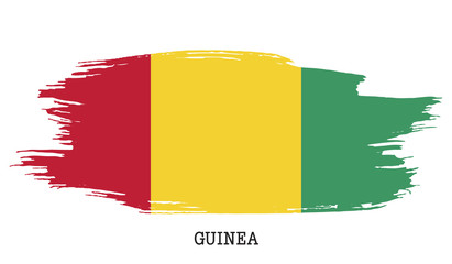 Obraz premium Guinea flag vector grunge paint stroke 