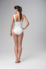 Fototapeta premium Attractive fit young woman posing in swimsuit