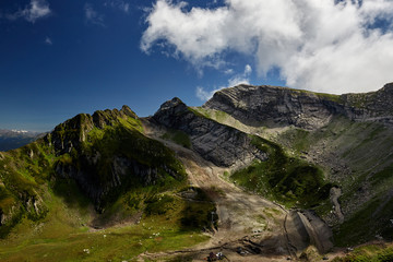 Naklejka premium Beautiful green mountain landscape with bright blue sky. North Caucasus.