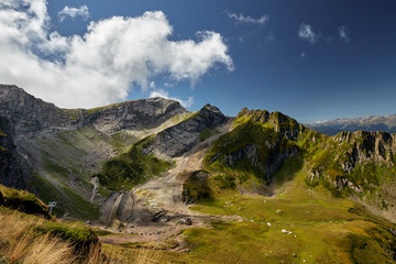 Naklejka premium Beautiful green mountain landscape with bright blue sky. North Caucasus.