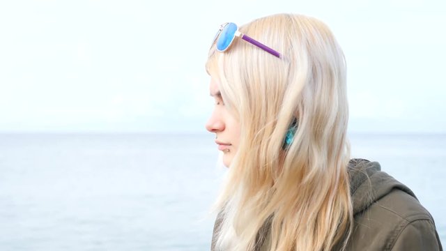 bodimodification, portrait of a girl with face piercings and tunnels in the ears. 4k, slow-motion shooting, copy space