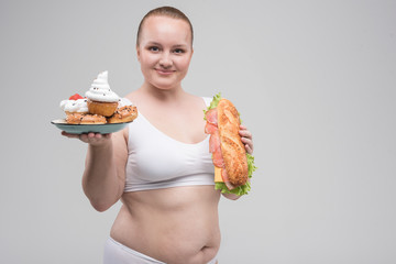 Woman holding foods in both of her hands