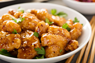 Spicy sweet and sour chicken with rice and cabbage
